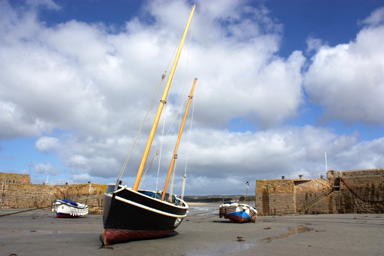 image Boats during low tide in the harbour of St Michael's Mount